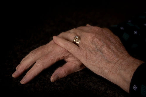 Elderly hands — arthritis compression gloves for pain relief